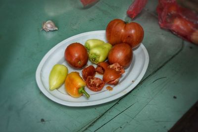 High angle view of fruits in plate on table