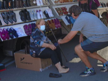 Rear view of people on display at store