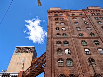 Low angle view of building against blue sky