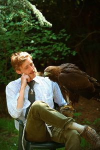 Man with golden eagle on field