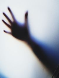 Close-up of human hand on wall