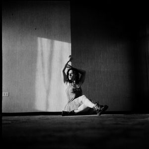 Portrait of woman sitting on floor