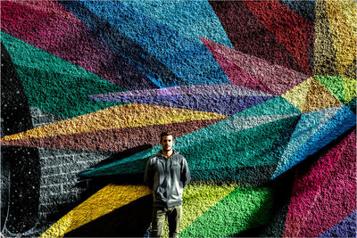 Rear view of graffiti on wall