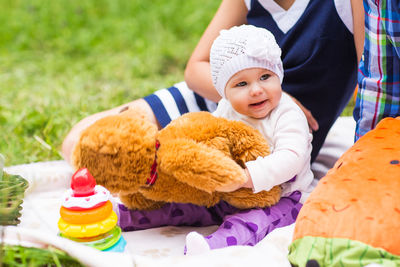 Cute baby girl with toy toys