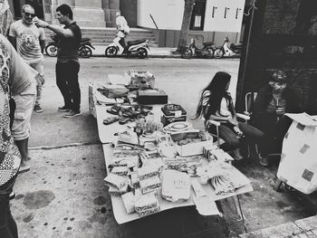 People standing on street market in city