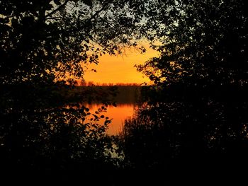 Scenic view of lake at sunset