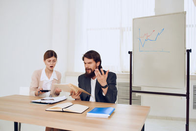 Worried business people sitting at office