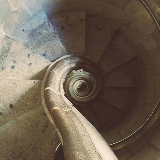 indoors, built structure, architecture, high angle view, circle, ceiling, low angle view, spiral staircase, pattern, metal, spiral, steps, history, staircase, old, arch, day, design, art and craft, directly below
