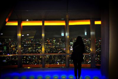 Woman standing at night