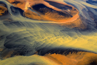 Colorful glacier rivers on the south coast of iceland with black sand