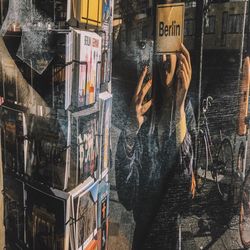 Reflection of woman standing on glass window