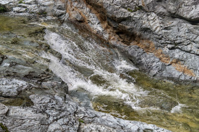 Full frame shot of water flowing through rocks