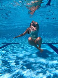 Woman swimming in sea