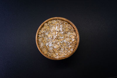 Directly above shot of coins on black background