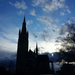 Low angle view of silhouette church against sky