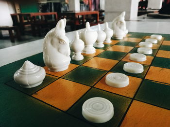 Close-up of chess pieces on table