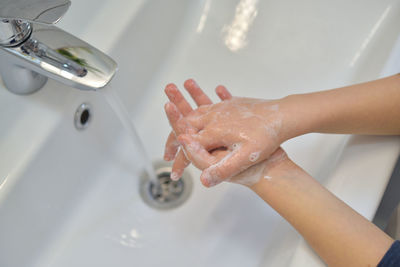High angle view of woman in bathroom at home