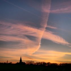 Silhouette temple against sky during sunset