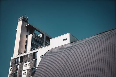 Low angle view of building against clear blue sky