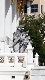 Statue in front of building