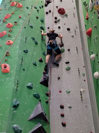 High angle view of people hiking a wall