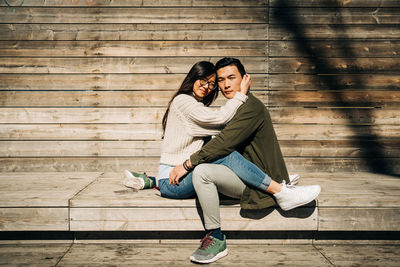 Young couple sitting outdoors