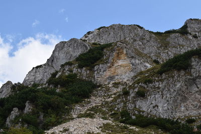 Low angle view of rock formations against sky