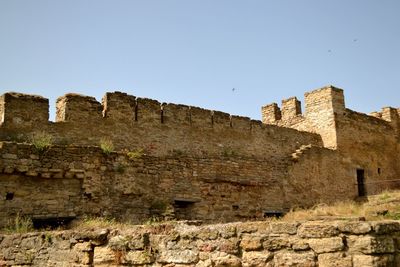 Low angle view of fort against clear sky