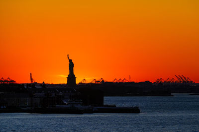 Silhouette of building at sunset