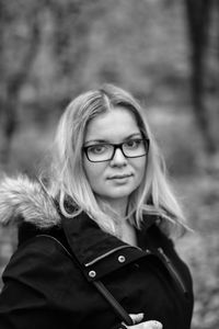 Portrait of young woman standing outdoors