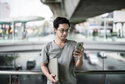 Young man using mobile phone