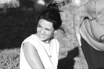 Portrait of smiling young woman on field