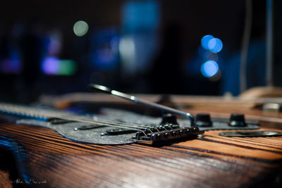 Close-up of guitar on table