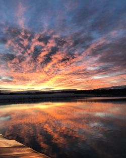 Scenic view of beach against dramatic sky