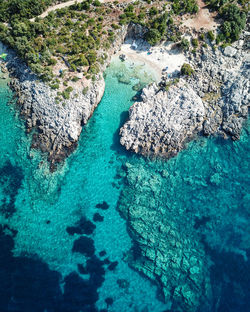 High angle view of rocks in sea