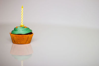 Close-up of cupcakes against white background