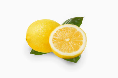 High angle view of lemon slice against white background