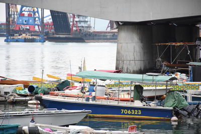 Boats moored at harbor