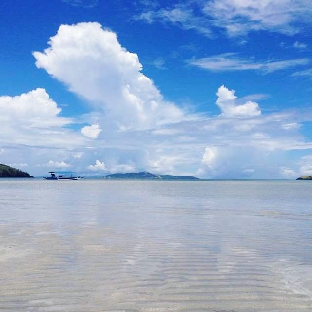 water, sea, sky, tranquil scene, tranquility, waterfront, scenics, beauty in nature, blue, cloud - sky, nature, cloud, nautical vessel, idyllic, beach, horizon over water, rippled, transportation, day, cloudy