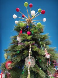 Low angle view of christmas tree against sky