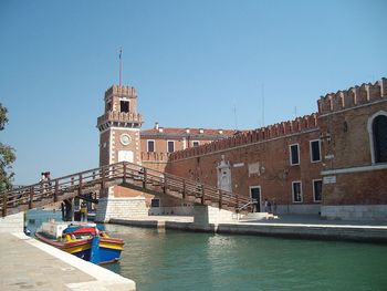 Fort by canal with sky in background