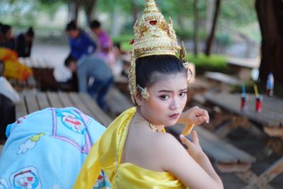 Young woman wearing traditional clothing and headdress