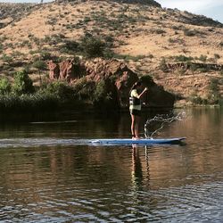 Scenic view of lake with mountains in background
