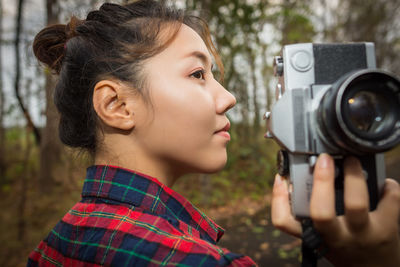Portrait of woman photographing