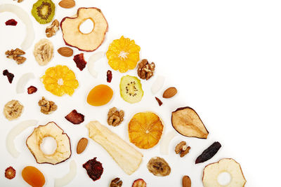 Directly above shot of fruits against white background