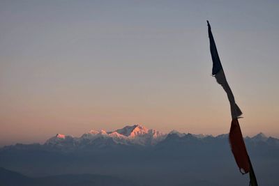 Scenic view of snowcapped mountains against sky during sunset