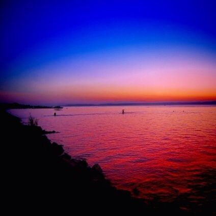 sunset, water, sea, silhouette, tranquil scene, scenics, tranquility, beauty in nature, orange color, horizon over water, sky, idyllic, copy space, nature, blue, dusk, calm, reflection, waterfront, rippled