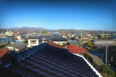 Residential buildings against blue sky