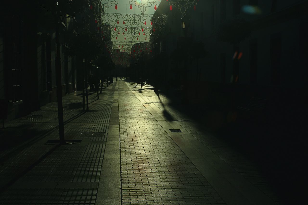 EMPTY FOOTPATH AMIDST BUILDINGS IN CITY