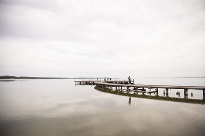 Pier on sea against sky